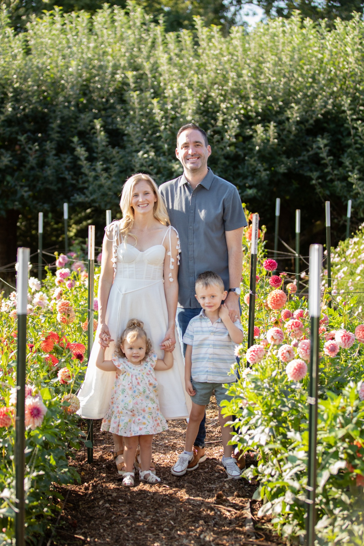 The Clair family standing together in the dahlia field